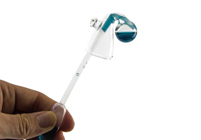 cleaning a drop checker with a pipette